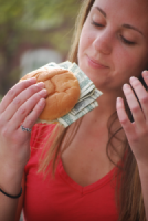 Student Eating Money Sandwich Can't Understand Why You're Worried about Graduating